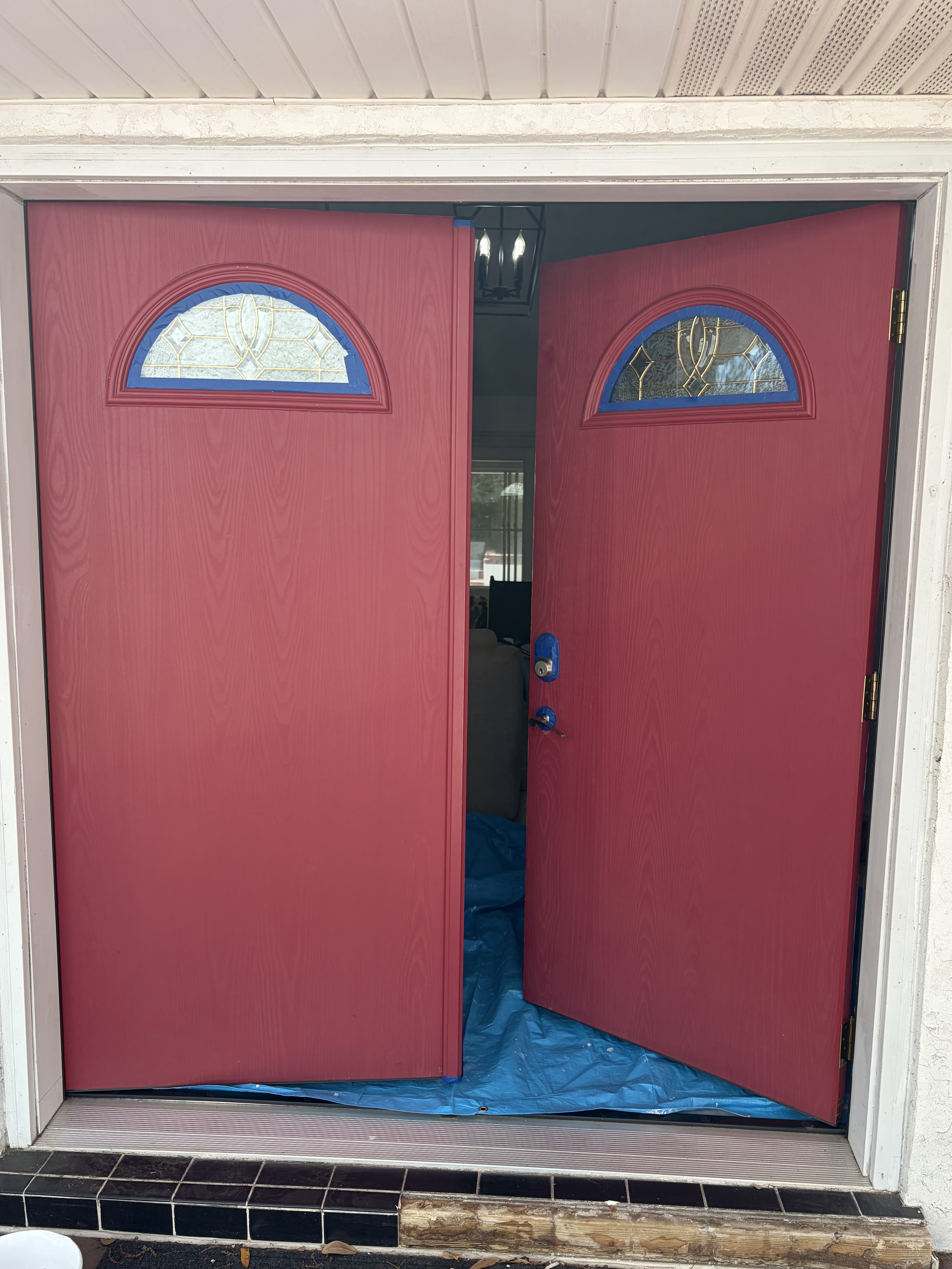 Before — red entry doors prior to restoration