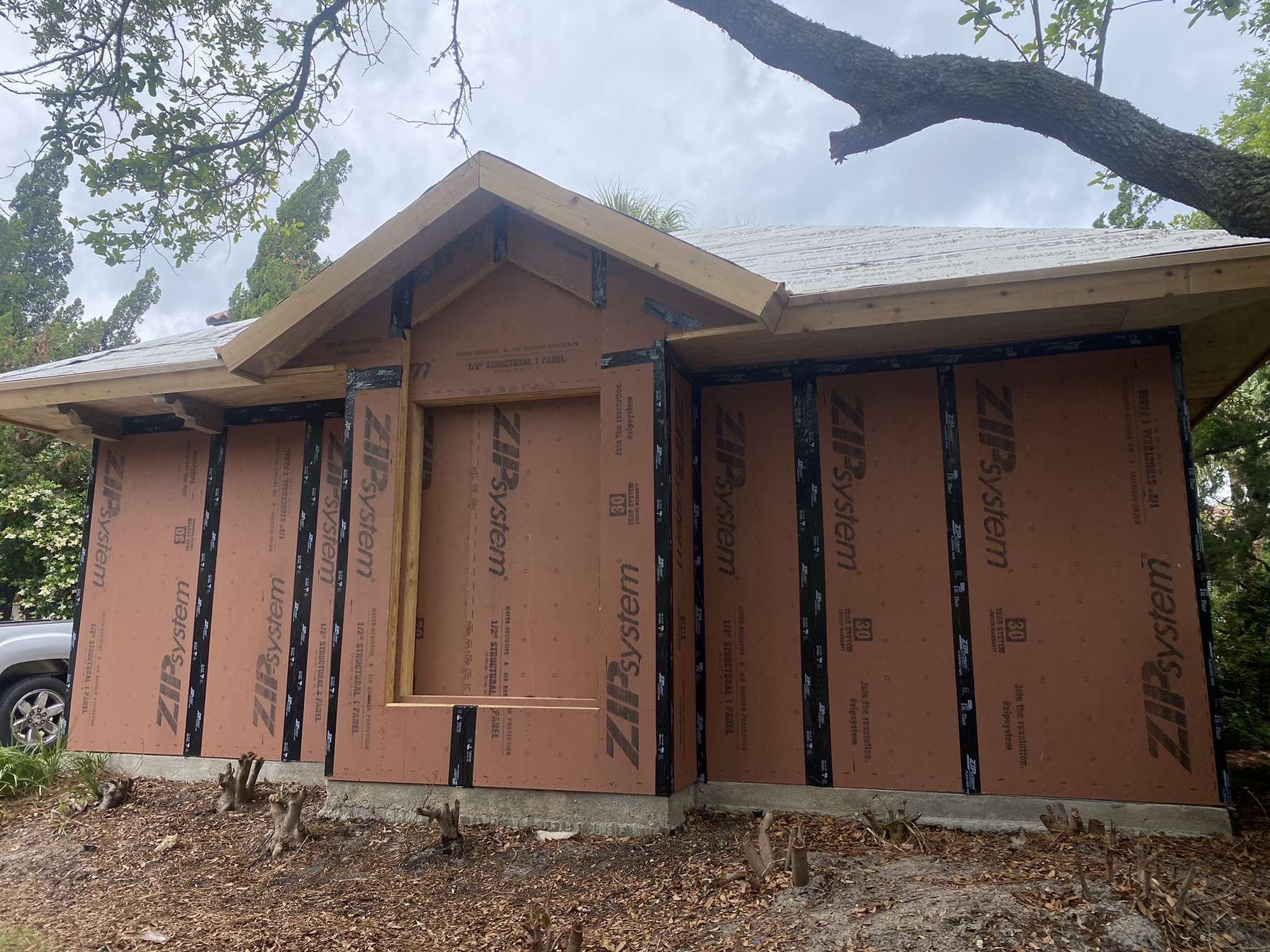 Before — exterior framing with ZIP system sheathing prior to stucco finish