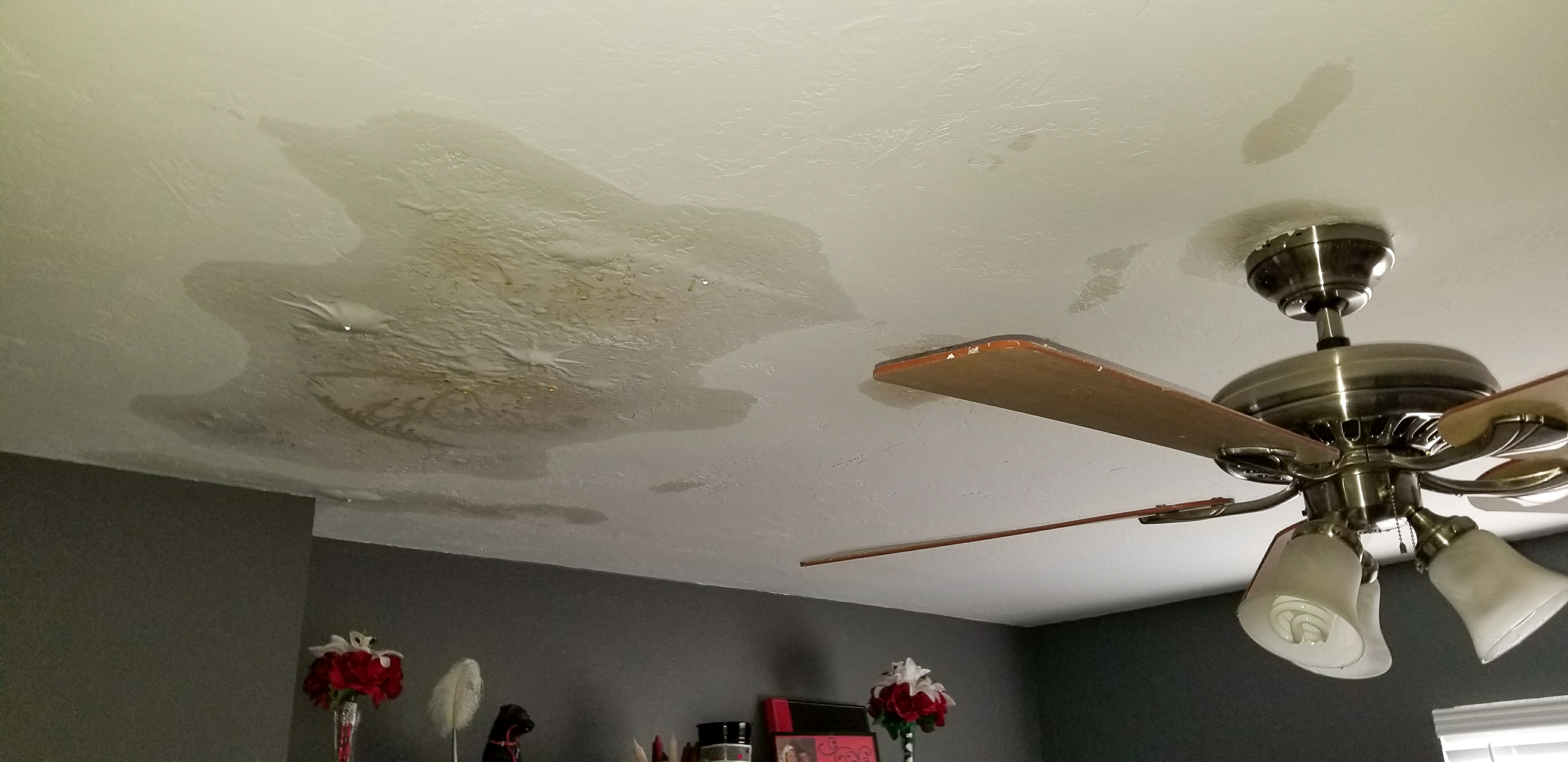 Water damage to ceiling — staining and structural deterioration requiring emergency restoration